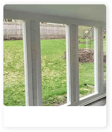 A view of the outside from inside a house.