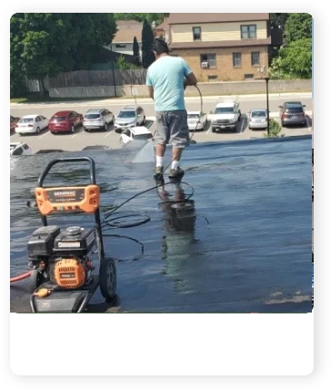 A man is standing on the side of a road.