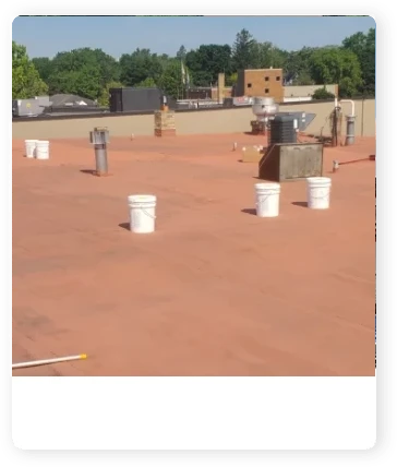 A picture of some buckets on the roof.